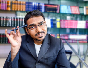 Indian teacher with pen